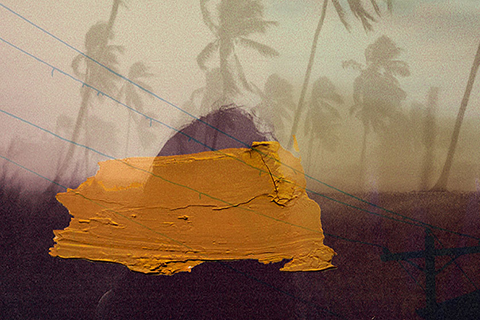 This is a composite image. There is an opaque background of trees swaying in a hurricane wind. In the mid-ground there is an opaque figure of a person. In the foreground there is a yellow paint brush stroke.