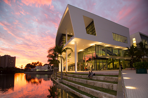 A photo of the Shalala Student Center during sunset on the University of Miami Coral Gables campus.