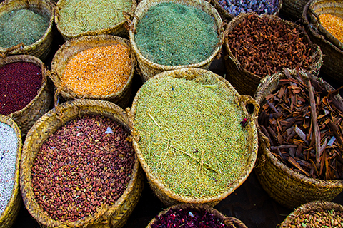 A zoomed in stock photo of spice baskets in a Sudanese spice market.